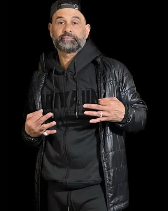 Nate Hampton in a black Ariyaun embossed hoodie